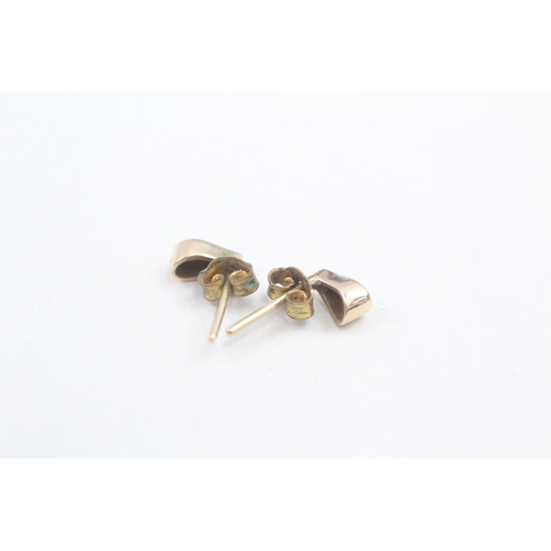 142 - 9ct gold diamond set teardrop stud earrings (1.2g)