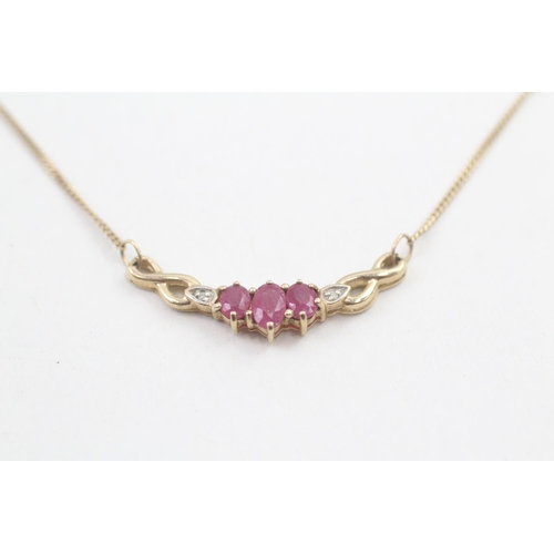 144 - 9ct gold diamond accented ruby set static pendant necklace (2.4g)