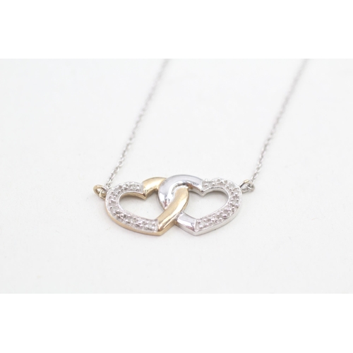 145 - 9ct white and yellow gold diamond set entwined heart static pendant necklace (2.1g)