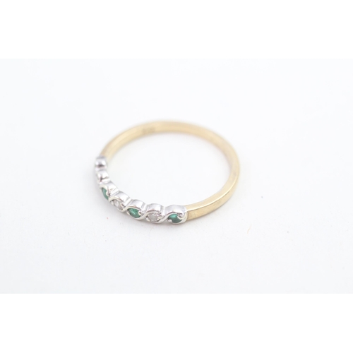 148 - 9ct gold diamond and emerald set seven stone eternity ring (1.8g) Size R