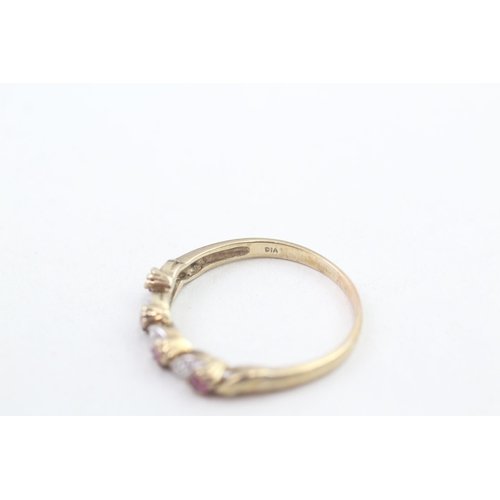150 - 9ct gold diamond and ruby set band ring (2.1g) Size U 1/2