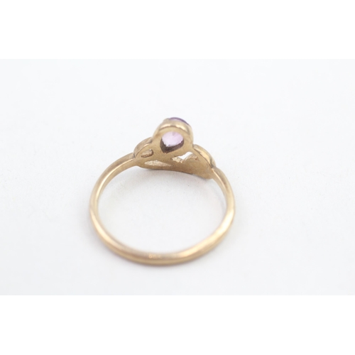 155 - 9ct gold pear cut amethyst set eternal knot dress ring (2.2g) Size P 1/2