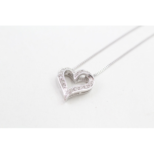 162 - 9ct white gold diamond set floating heart pendant necklace (2.2g)