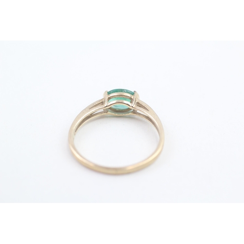 165 - 9ct gold emerald and white gemstone set dress ring (2.3g) Size U