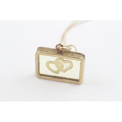 194 - 9ct gold vintage floating entwined hearts pendant necklace (4.5g)