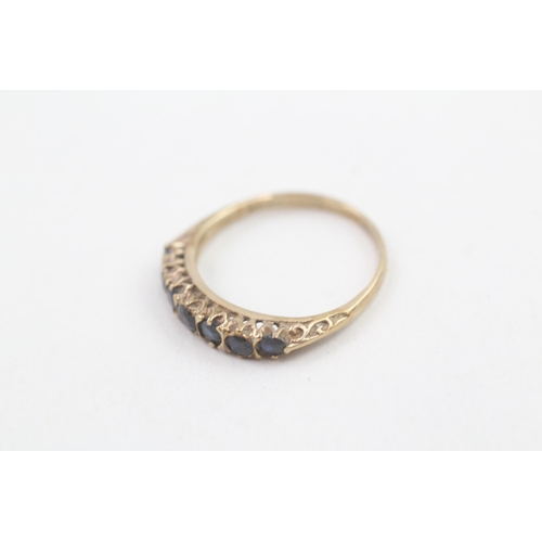 206 - 9ct gold sapphire set seven stone eternity ring (1.5g) Size M 1/2