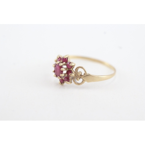 76 - 9ct gold ruby floral cluster ring with openwork shank (1.7g) Size T 1/2