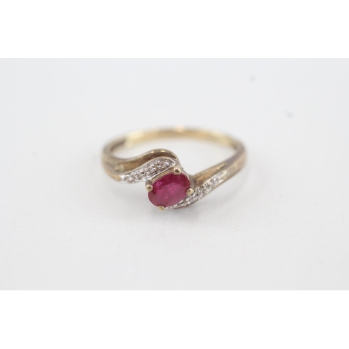 89 - 9ct gold diamond & ruby bypass ring (2.3g) Size Q 1/2