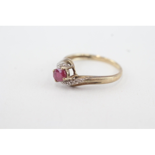 89 - 9ct gold diamond & ruby bypass ring (2.3g) Size Q 1/2