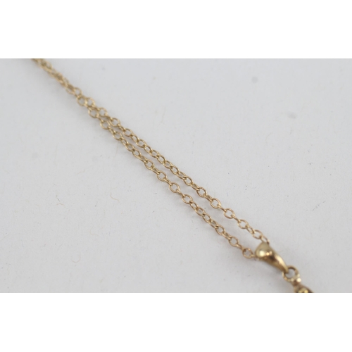 95 - 9ct gold diamond & ruby cross pendant necklace (2g)