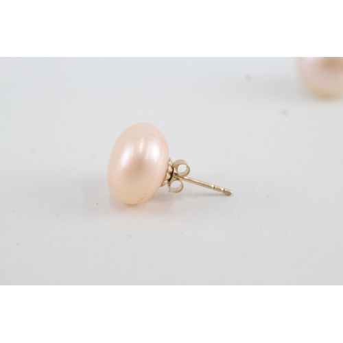 104 - 9ct gold cultured pearl single stone stud earrings (3.4g)