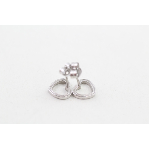 11 - 9ct white gold contemporary diamond accented floating heart stud earrings (0.8g)