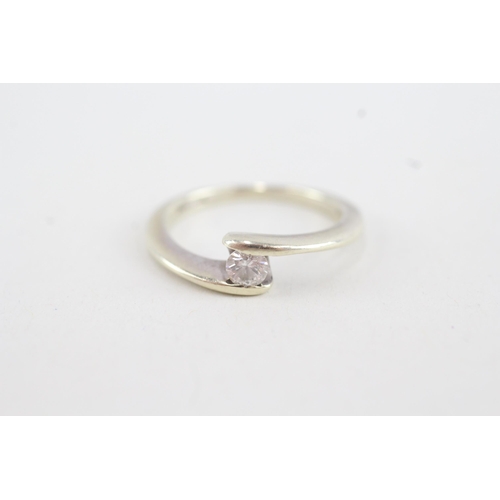 128 - 9ct gold round brilliant diamond bypass ring (2.7g) Size  L 1/2