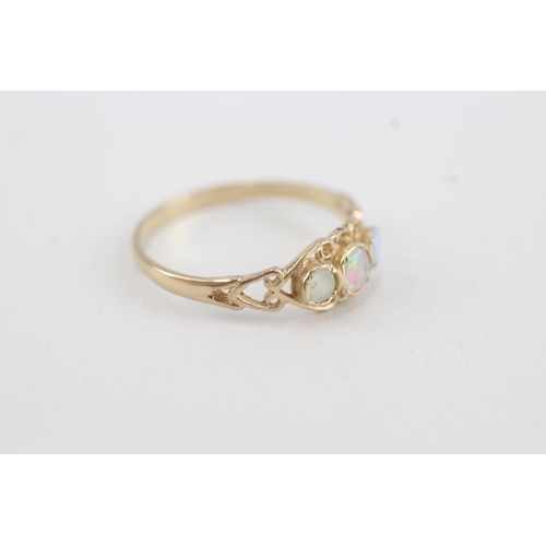 134 - 9ct gold opal three stone ring with openwork shank (1.5g) Size  R