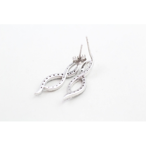 140 - 9ct white gold black and white diamond set twist long stud earrings (2.5g)