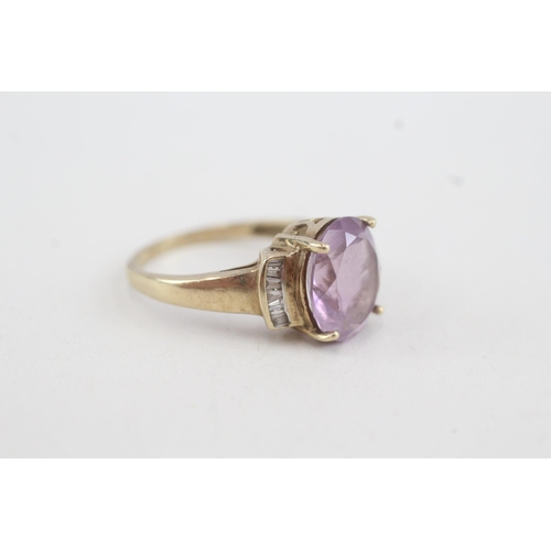 147 - 9ct gold oval amethyst single stone ring with calibre diamond set shoulders (3.3g) Size  P