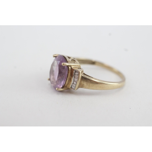 147 - 9ct gold oval amethyst single stone ring with calibre diamond set shoulders (3.3g) Size  P