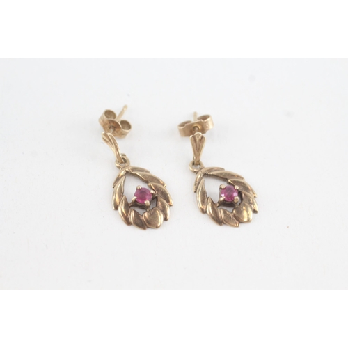 173 - 9ct gold ruby openwork drop earrings (2.2g)