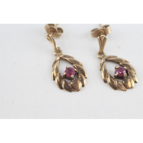 173 - 9ct gold ruby openwork drop earrings (2.2g)