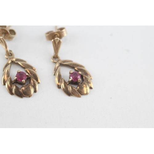 173 - 9ct gold ruby openwork drop earrings (2.2g)