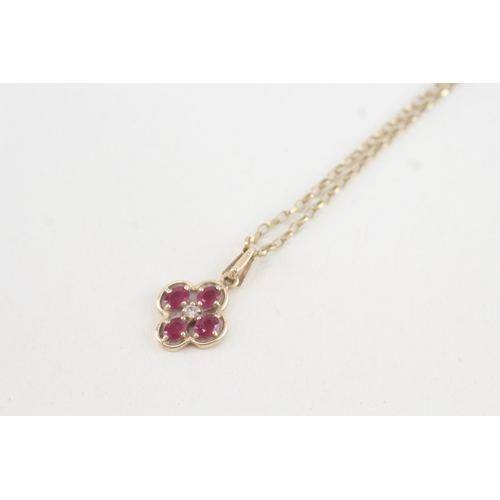 215 - 9ct gold diamond & ruby five stone cluster pendant necklace (2.7g)
