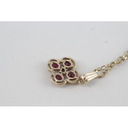 215 - 9ct gold diamond & ruby five stone cluster pendant necklace (2.7g)
