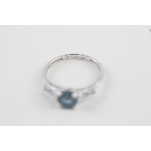 237 - 9ct gold vari-hue blue topaz three stone ring (1.7g) Size  L 1/2