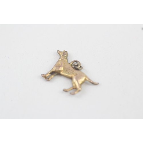 243 - 9ct gold dog charm (0.4g)