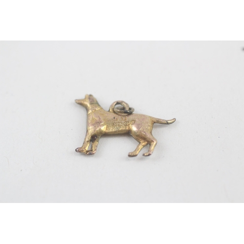243 - 9ct gold dog charm (0.4g)