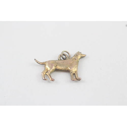 243 - 9ct gold dog charm (0.4g)