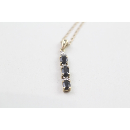 254 - 9ct gold diamond and sapphire line pendant on chain (1.6g)