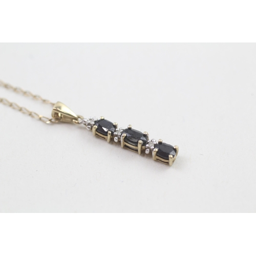 254 - 9ct gold diamond and sapphire line pendant on chain (1.6g)