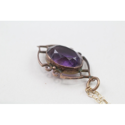 255 - 9ct gold amethyst framed pendant on chain (4g)