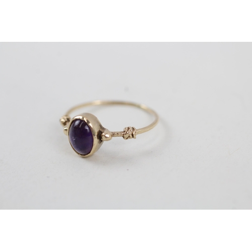 264 - 9ct gold amethyst cabochon set delicate dress ring (1.2g) Size  K 1/2