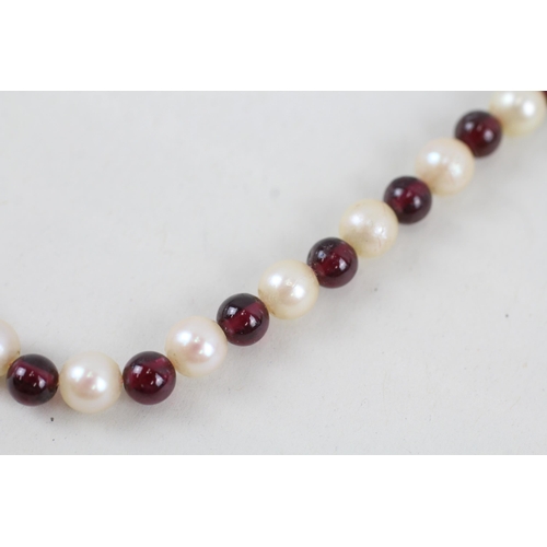 270 - 9ct white gold garnet and cultured pearl bead necklace (30.9g)