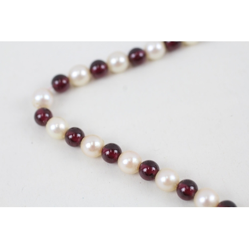 270 - 9ct white gold garnet and cultured pearl bead necklace (30.9g)