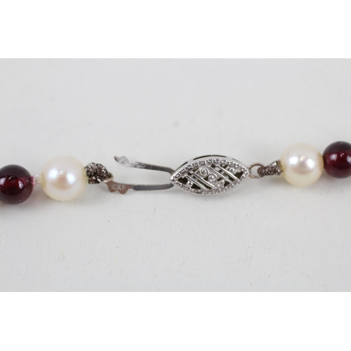 270 - 9ct white gold garnet and cultured pearl bead necklace (30.9g)