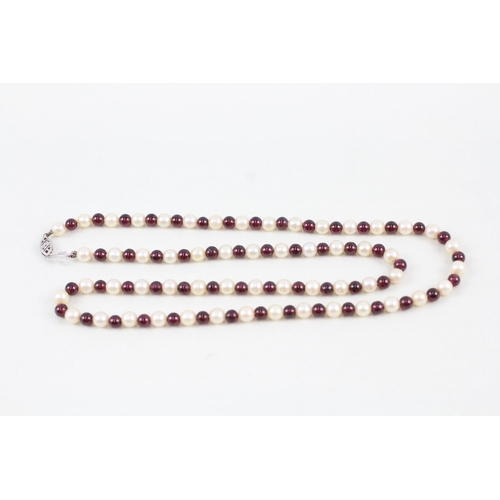 270 - 9ct white gold garnet and cultured pearl bead necklace (30.9g)