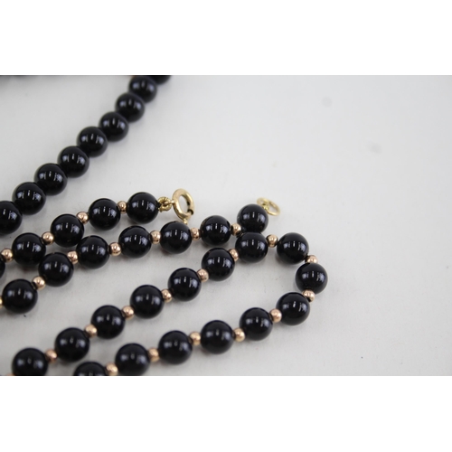 45 - 2x 9ct gold black onyx necklaces (47.7g)