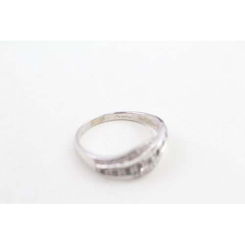 55 - 9ct white gold black and white diamond set wrap over ring (2.3g) Size  O