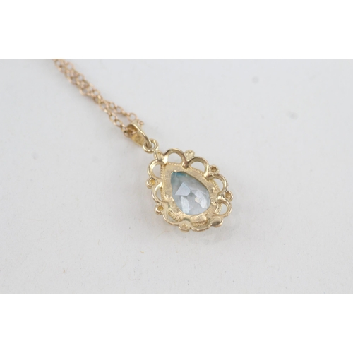 66 - 9ct gold pear shaped topaz pendant necklace (2.7g)