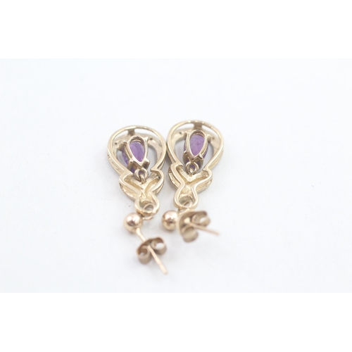 68 - 9ct gold diamond accented amethyst teardrop shaped drop earrings (2.7g)