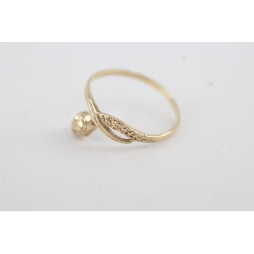 90 - 9ct gold snake ring with citrine paste eyes (1.2g)