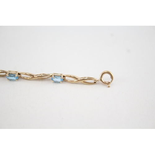 94 - 9ct gold topaz fancy link bracelet (4.1g)