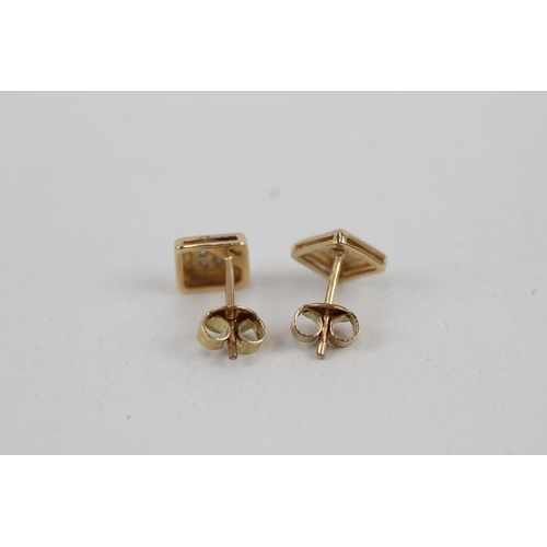 104 - 9ct gold diamond stud earrings (1.2g)