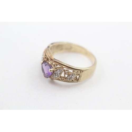 112 - 9ct gold diamond accented heart cut amethyst dress ring (3.5g) Size  M