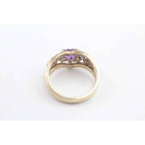 112 - 9ct gold diamond accented heart cut amethyst dress ring (3.5g) Size  M