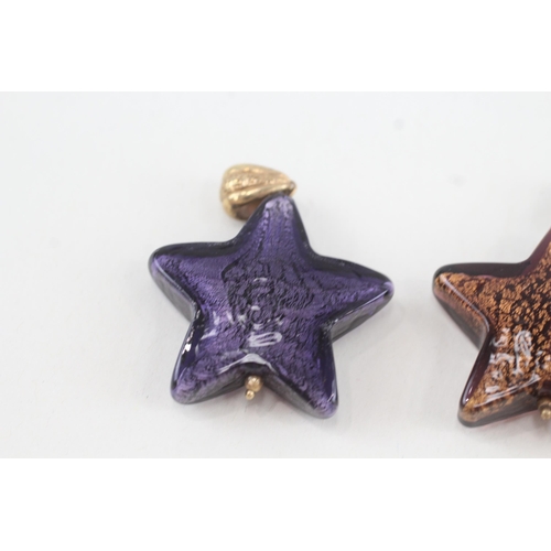 118 - 2x 9ct gold murano glass star pendants (17.5g)