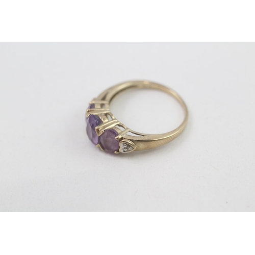 133 - 9ct gold diamond accented amethyst set trilogy ring (2.2g) Size  K