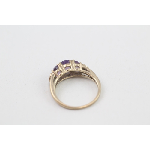 133 - 9ct gold diamond accented amethyst set trilogy ring (2.2g) Size  K